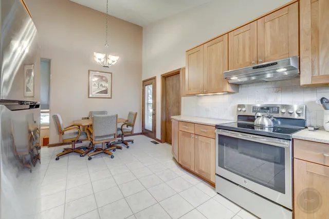 a kitchen with a sink cabinets and appliances