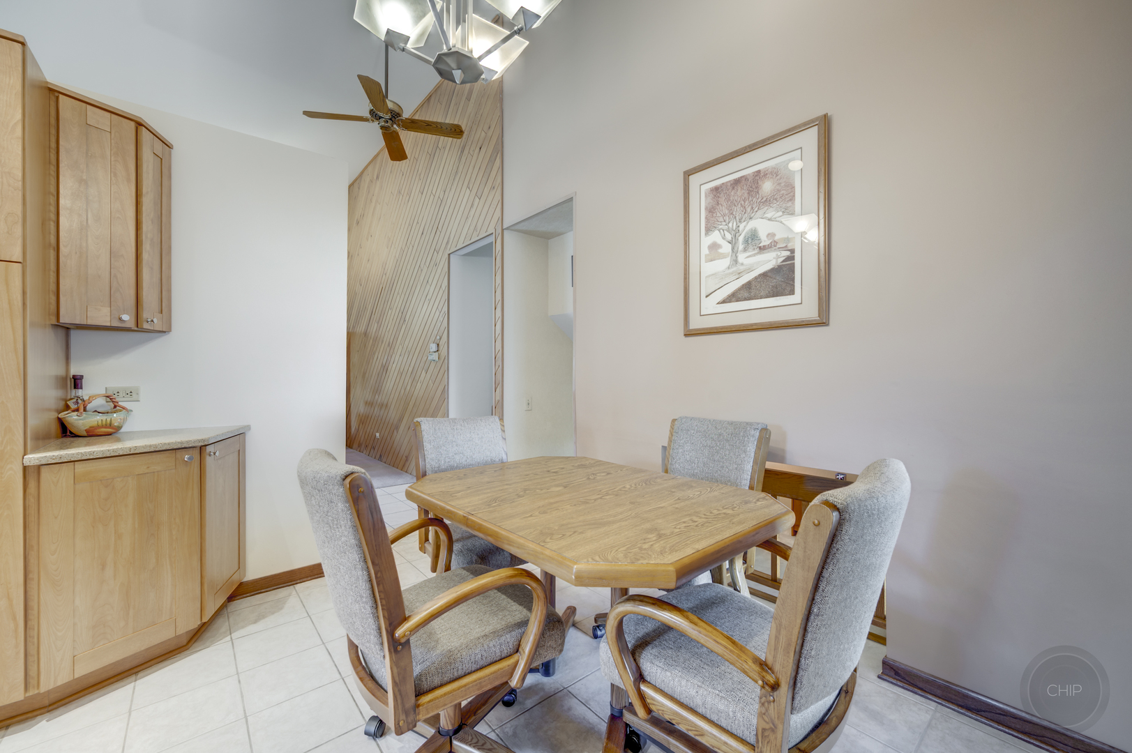 1259 Natchez Trace Circle Naperville, IL 60565 - Photo 14 of 56 a view of a dining room with furniture and a chandelier