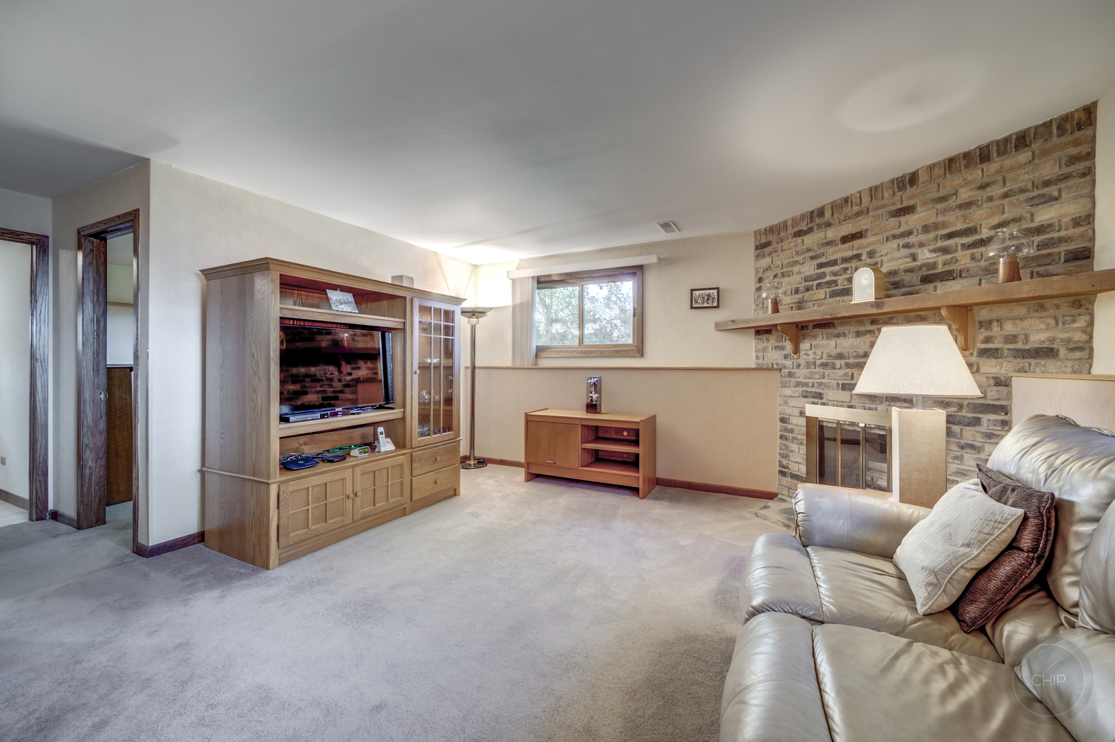 1259 Natchez Trace Circle Naperville, IL 60565 - Photo 18 of 56 a living room with furniture and a flat screen tv