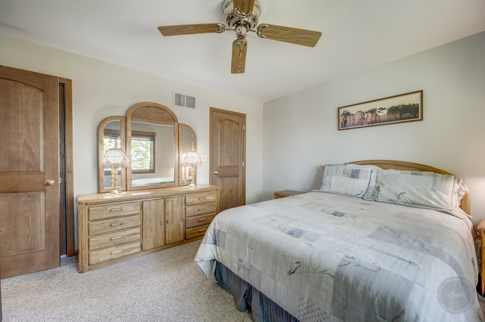 1259 Natchez Trace Circle Naperville, IL 60565 - Photo 21 of 56 a bedroom with a bed and a chandelier