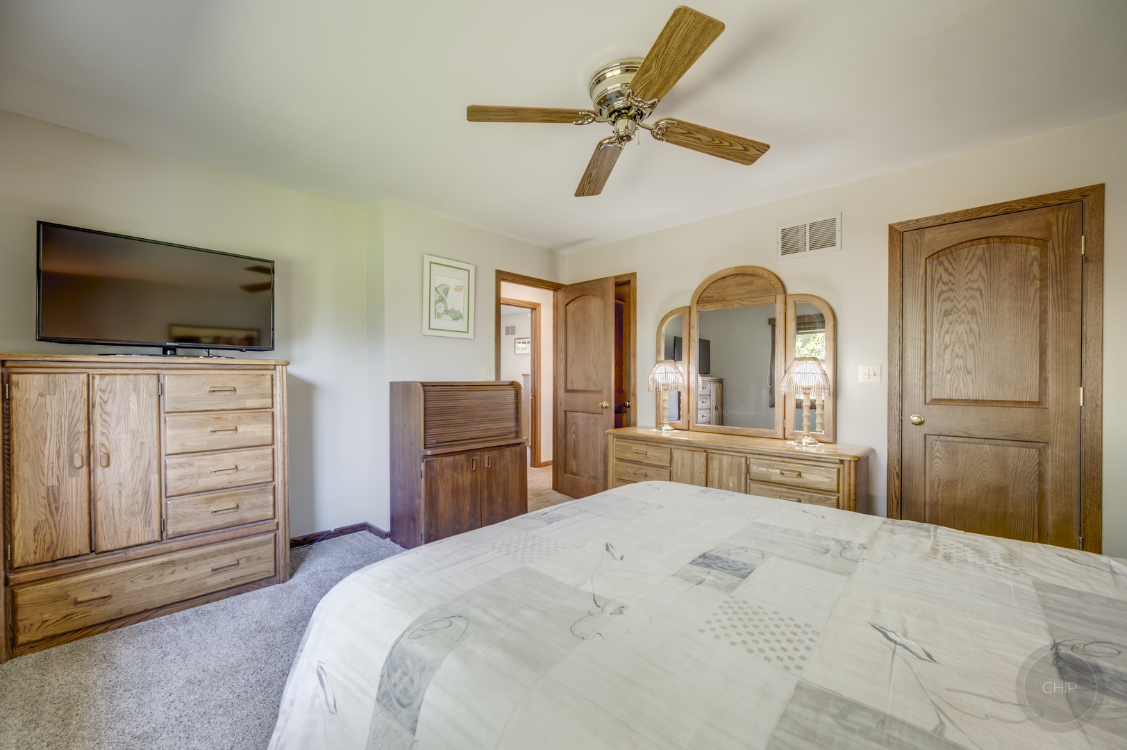 1259 Natchez Trace Circle Naperville, IL 60565 - Photo 24 of 56 a bedroom with a bed and a flat screen tv