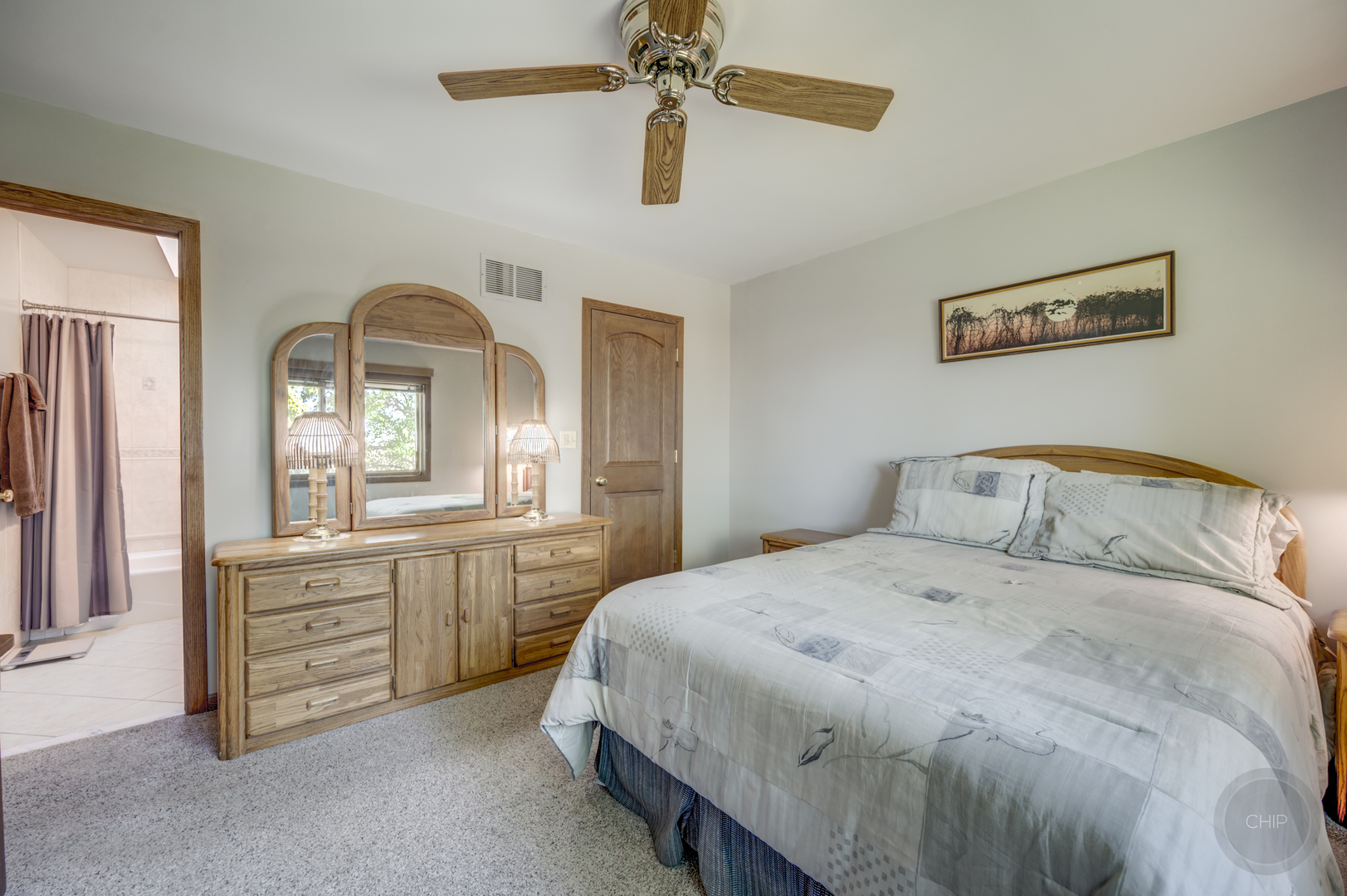 1259 Natchez Trace Circle Naperville, IL 60565 - Photo 25 of 56 a bedroom with a bed and a chandelier