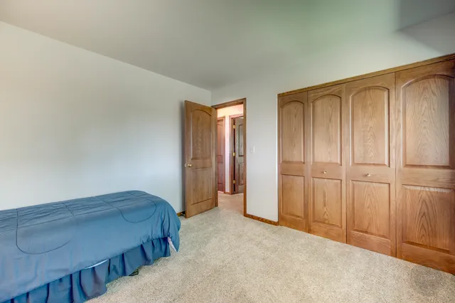 a view of an empty room and wooden floor