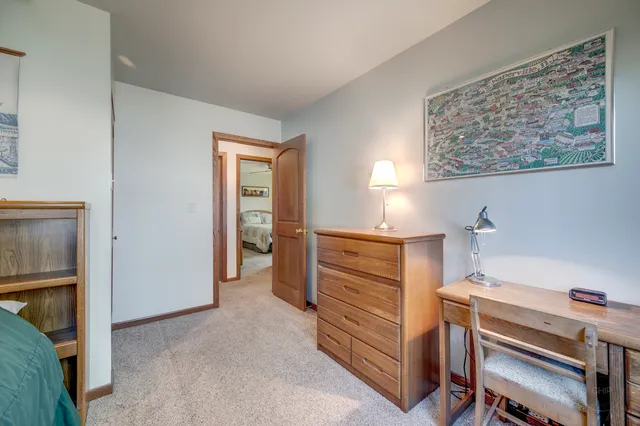 a room with a bed and a window