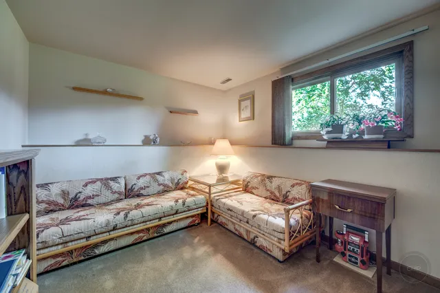 a room with furniture and a flat screen tv