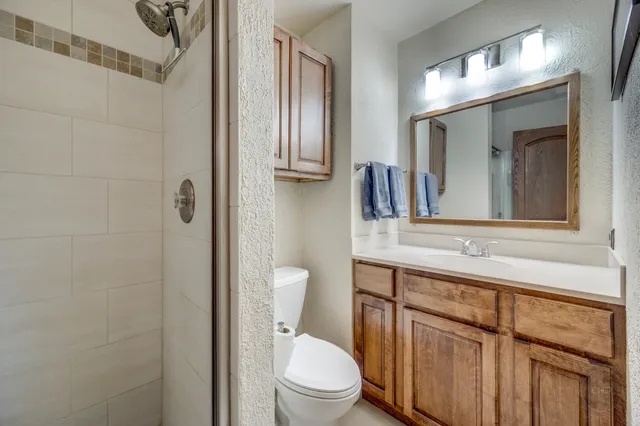 a bedroom with furniture and window