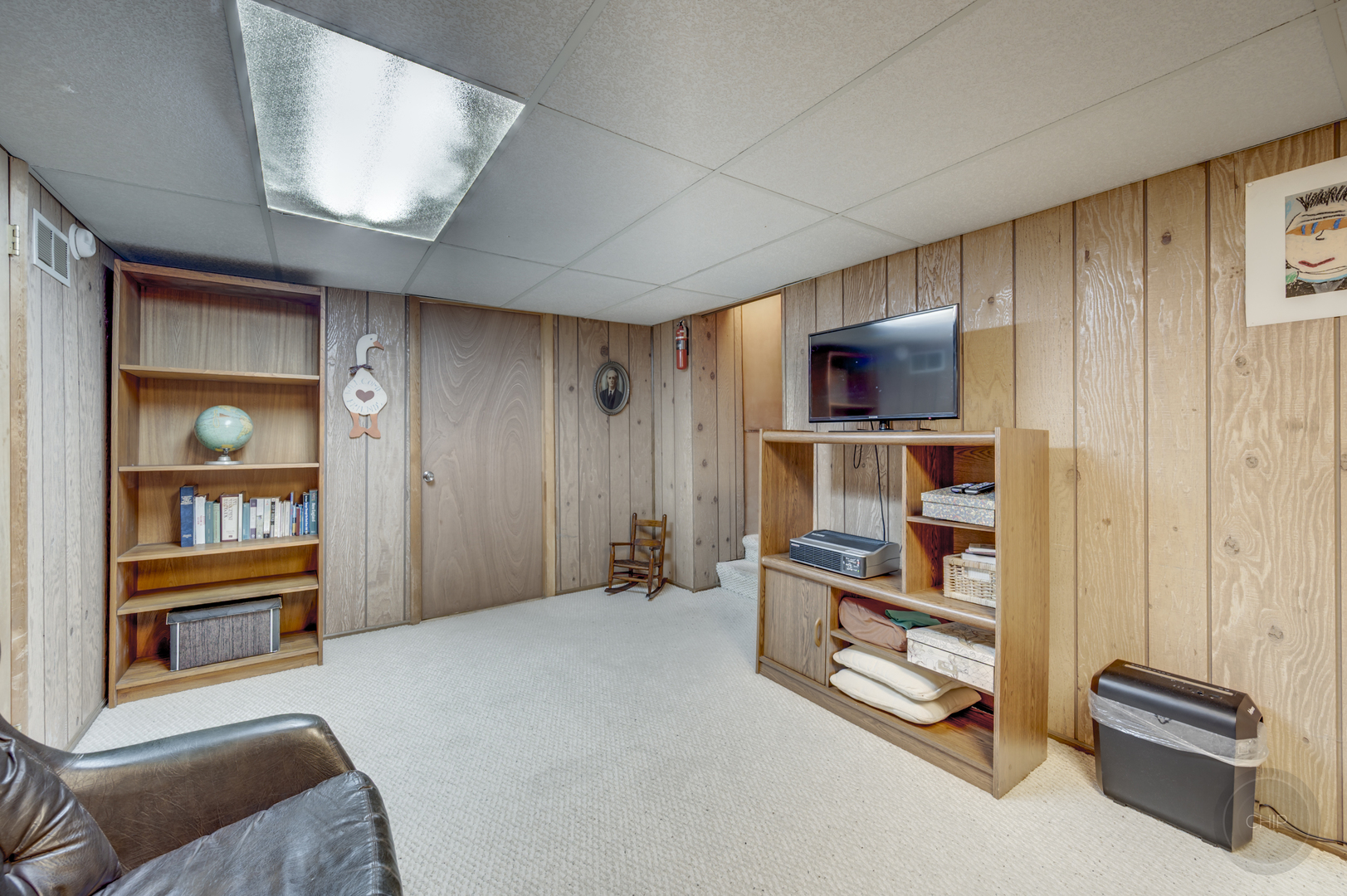 1259 Natchez Trace Circle Naperville, IL 60565 - Photo 39 of 56 a living room with furniture and a flat screen tv