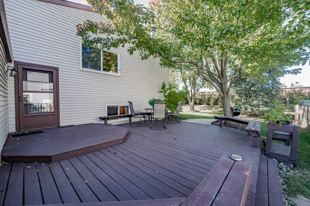a backyard of a house with yard and outdoor seating
