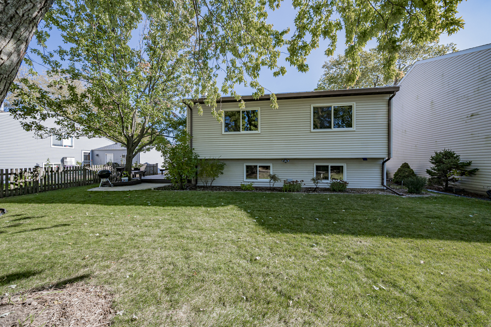 1259 Natchez Trace Circle Naperville, IL 60565 - Photo 50 of 56 a view of a house with a back yard