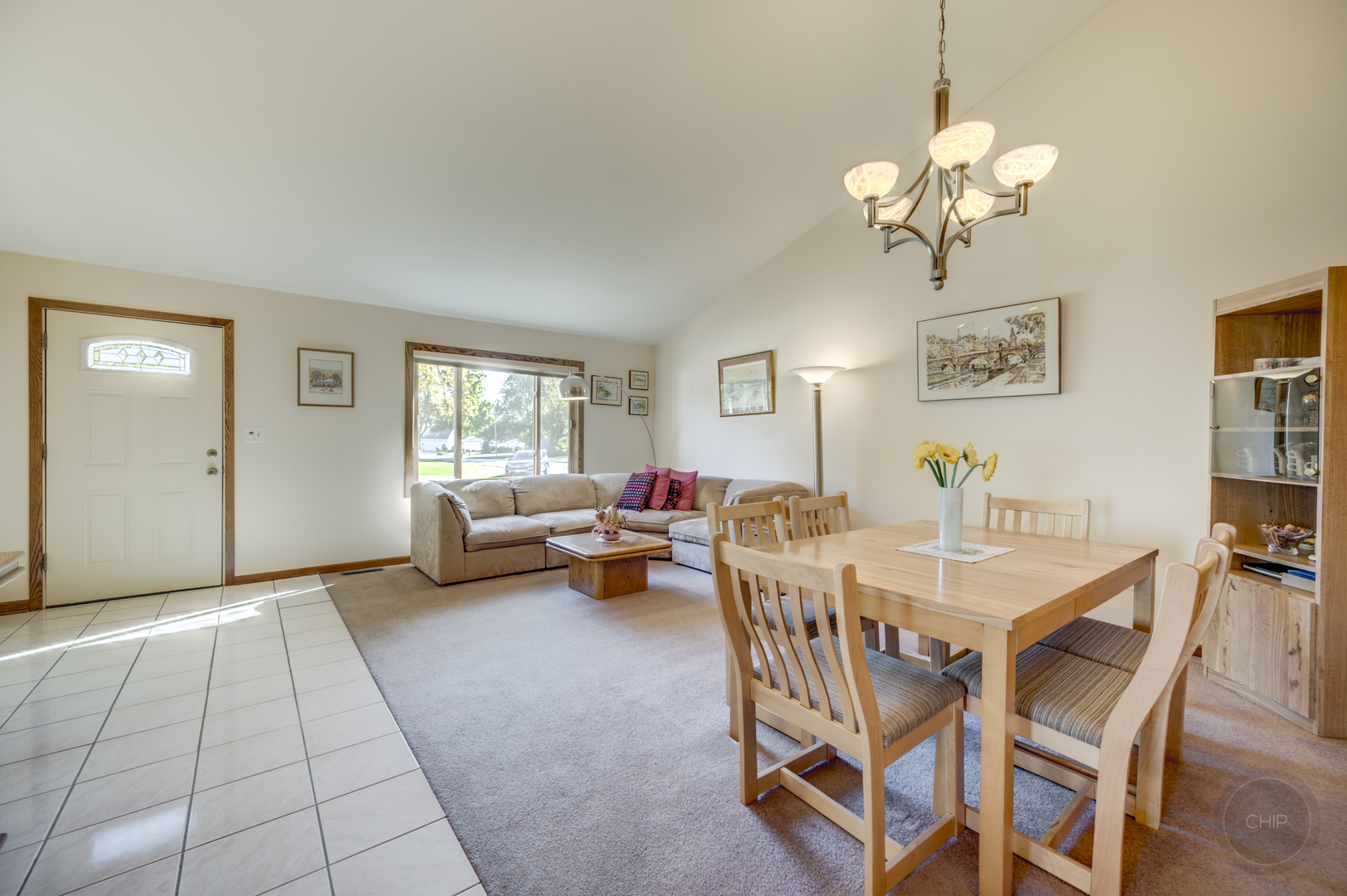 1259 Natchez Trace Circle Naperville, IL 60565 - Photo 5 of 56 a view of a dining room with furniture and chandelier