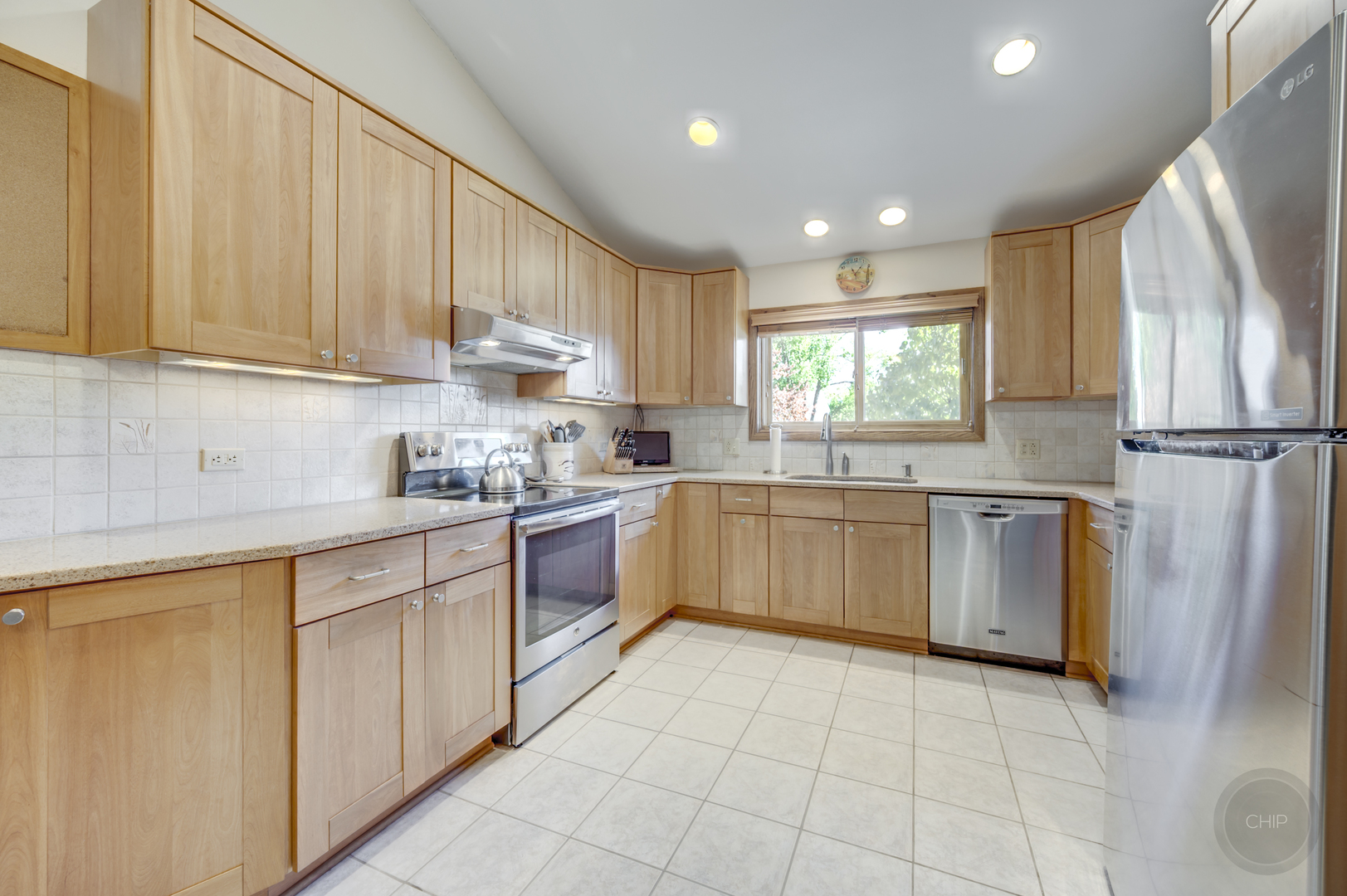 1259 Natchez Trace Circle Naperville, IL 60565 - Photo 10 of 56 a kitchen with stainless steel appliances granite countertop a refrigerator sink and cabinets