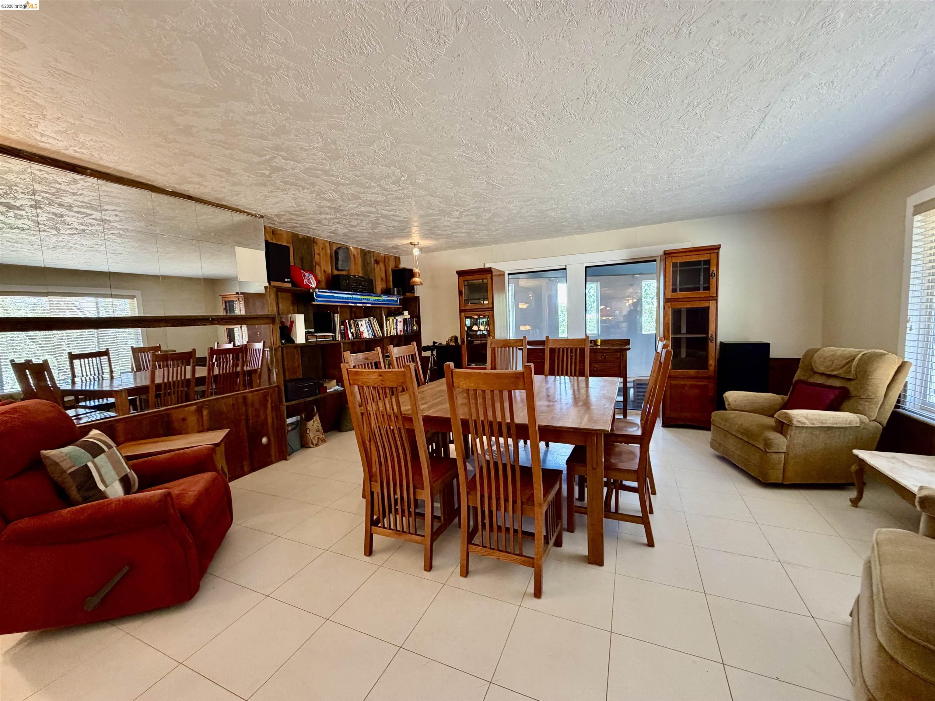 18195 Wards Ferry Road Sonora, CA 95370 - Photo 17 of 67 Expansive room featuring light-toned square floor tiling and a textured ceiling