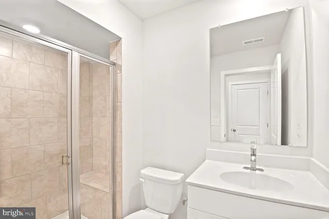 a bathroom with a sink a toilet and a bathtub