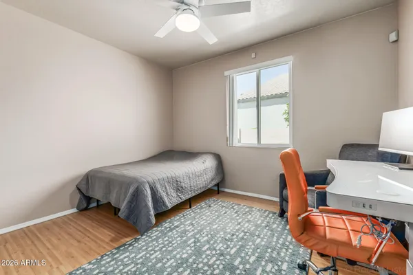 a bedroom with bed and a window