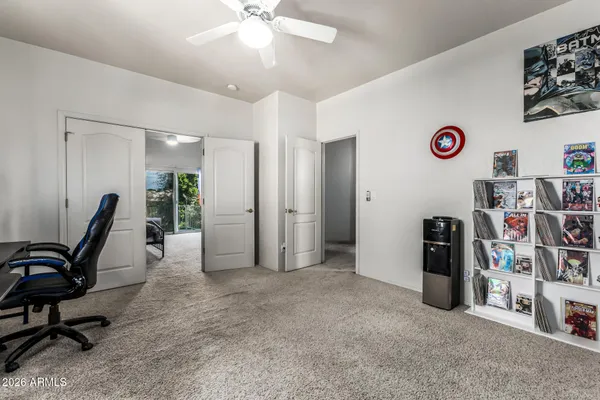 a view of a livingroom with furniture and a window