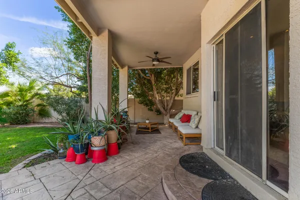 a backyard of a house with outdoor seating