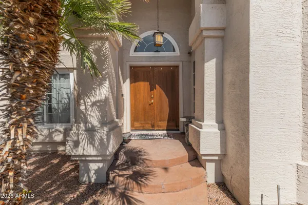 a view of balcony with a table and chairs