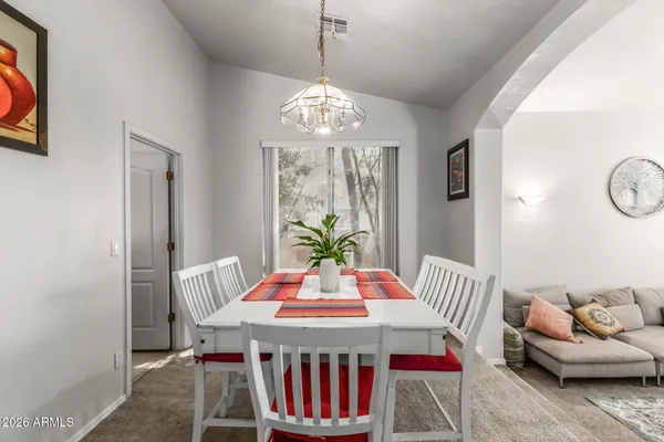 a view of a dining room with furniture window and outside view