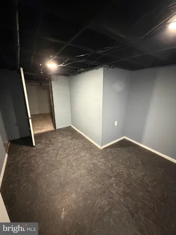 an empty room with a empty space and windows