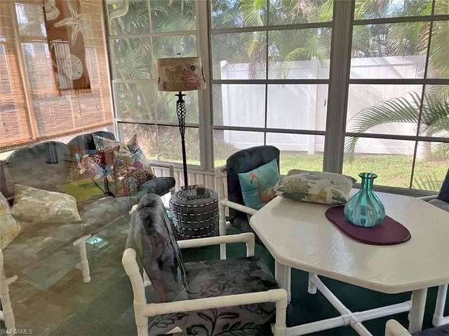 a living room with furniture and window
