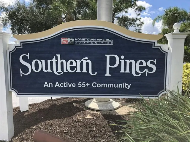 a sign broad on a brick wall