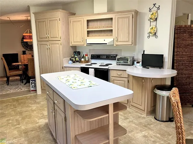 a kitchen that has a cabinets and a stove