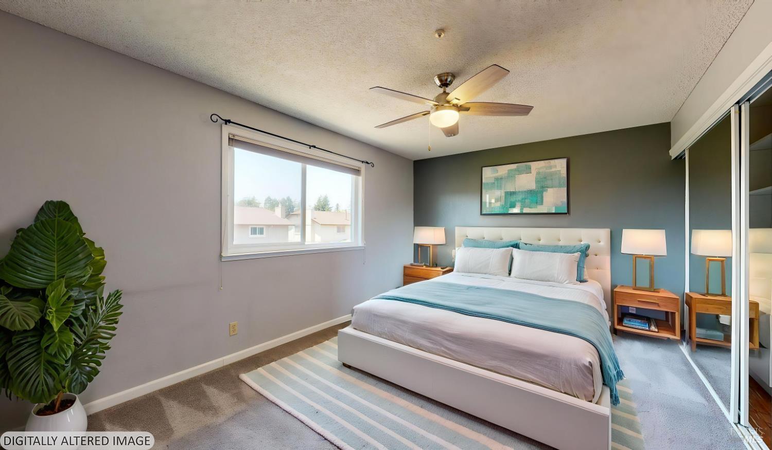 4571 Harbor Lane Rohnert Park, CA 94928 - Photo 30 of 79 a bedroom with a bed ceiling fan and a window