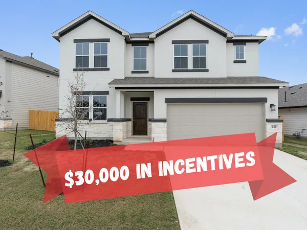 a view of a house with a backyard and a patio