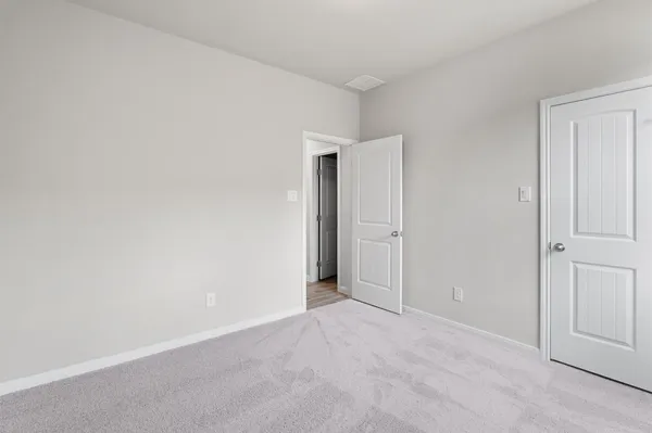 a living room with furniture a flat screen tv and a rug