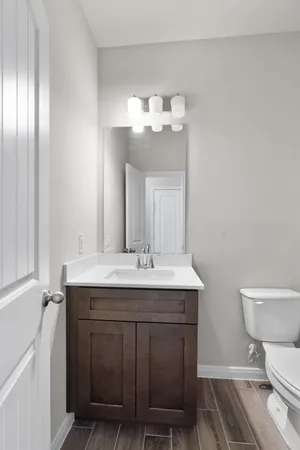a bathroom with a sink a toilet and bathtub
