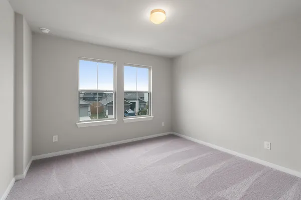 a view of a house with a yard and garage