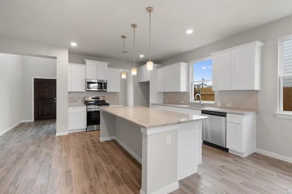 a view of a chandelier in a room with a window