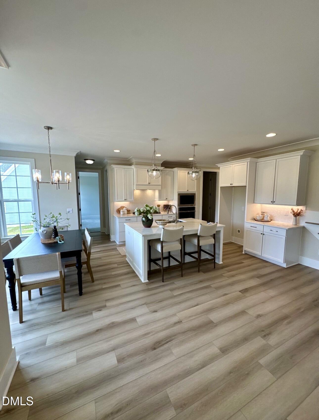 1057 Azalea Garden Circle Raleigh, NC 27603 - Photo 9 of 20 a living room with furniture and kitchen view