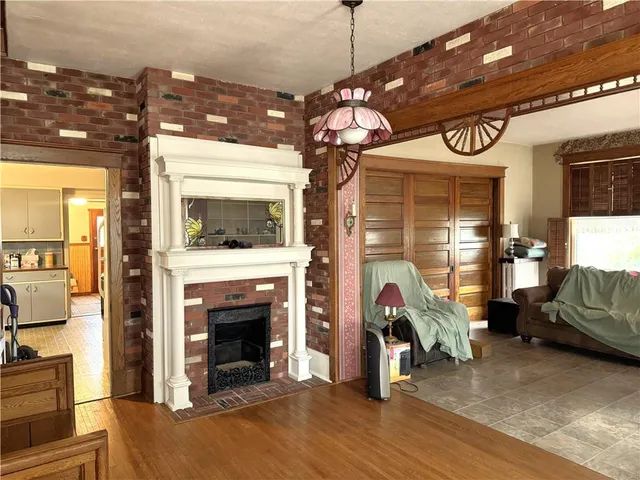 a view of a livingroom with furniture and a fireplace