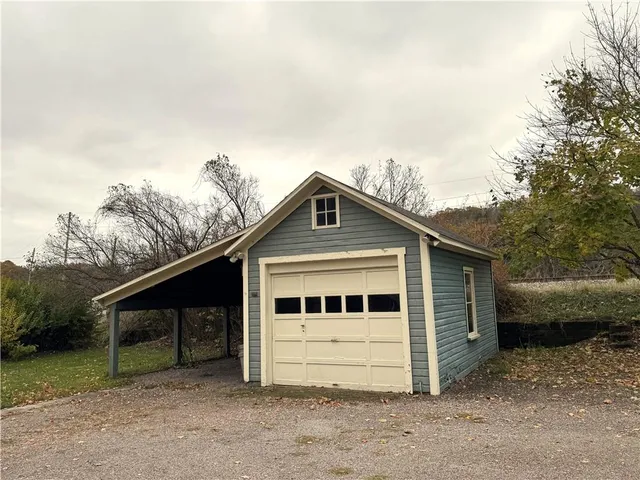 a view of a house with a backyard