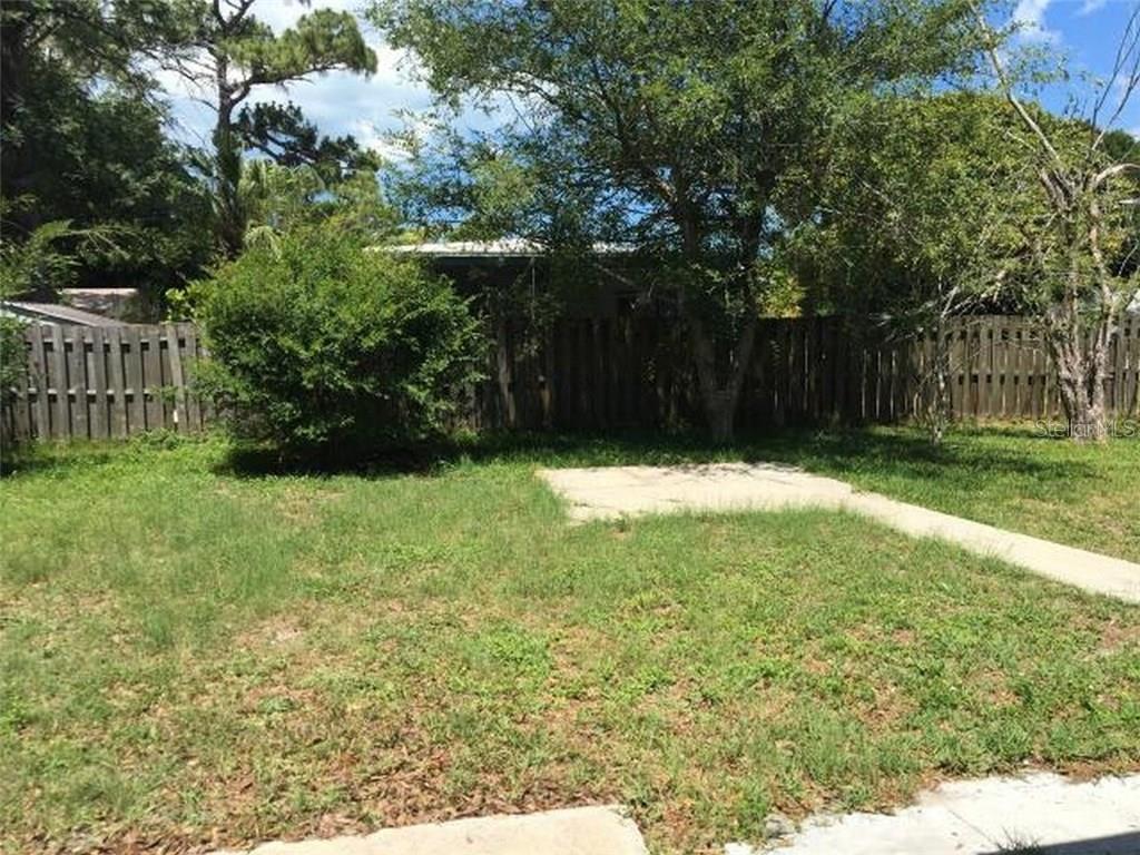 1920 Trotter Road Largo, FL 33774 - Photo 17 of 19 a view of swimming pool with wooden fence