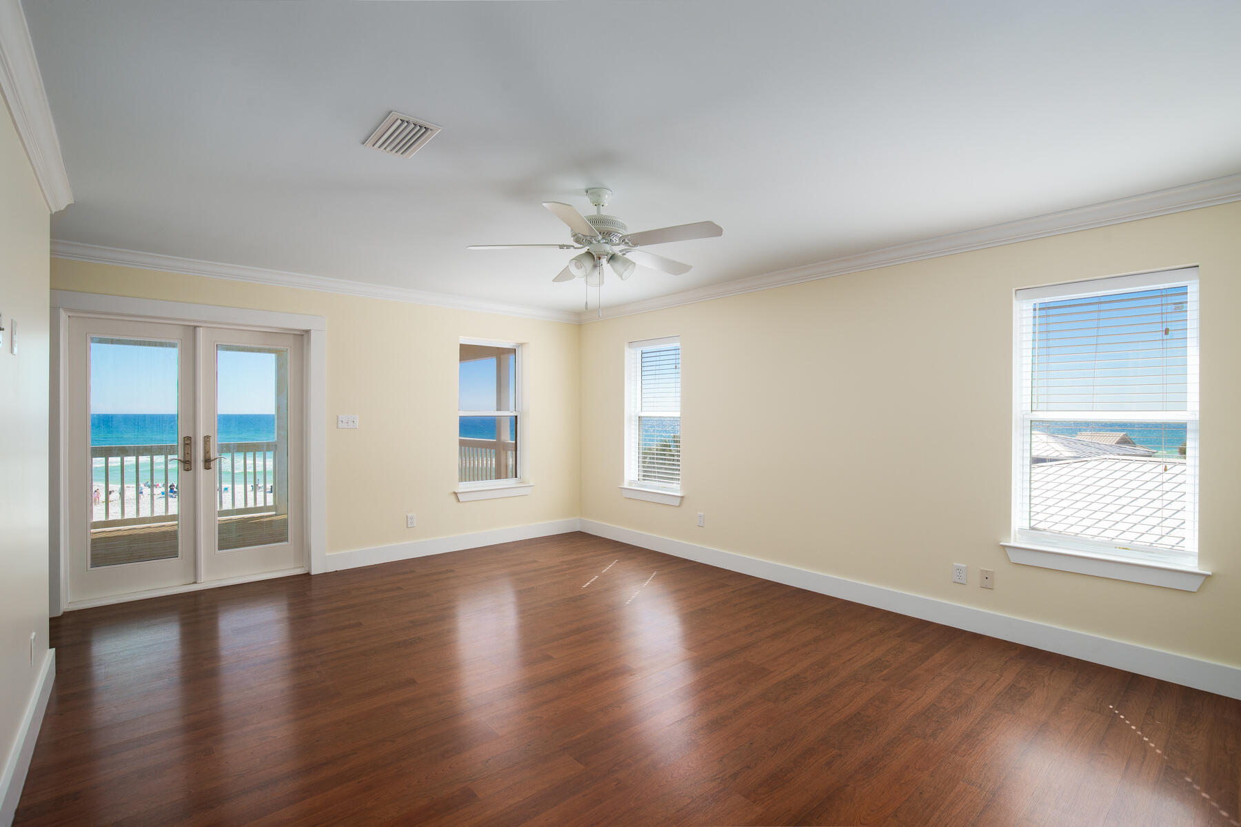 2 Hotz Avenue Santa Rosa Beach, FL 32459 - Photo 24 of 54 a view of an empty room with wooden floor and a window
