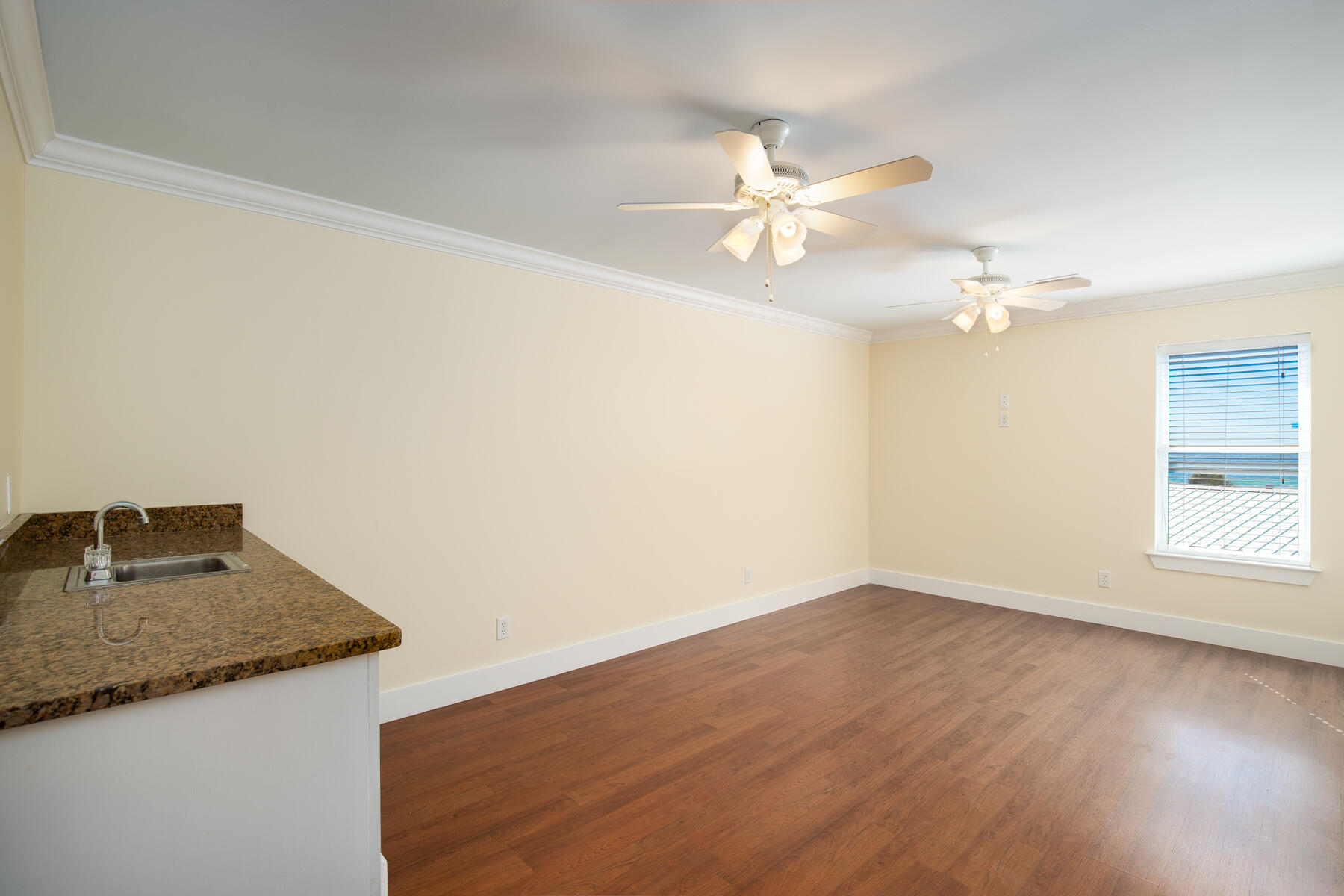 2 Hotz Avenue Santa Rosa Beach, FL 32459 - Photo 27 of 54 an empty room with a window and ceiling fan