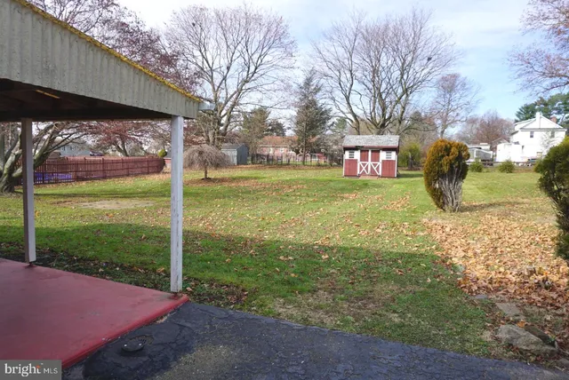 a kitchen with granite countertop white cabinets and appliances