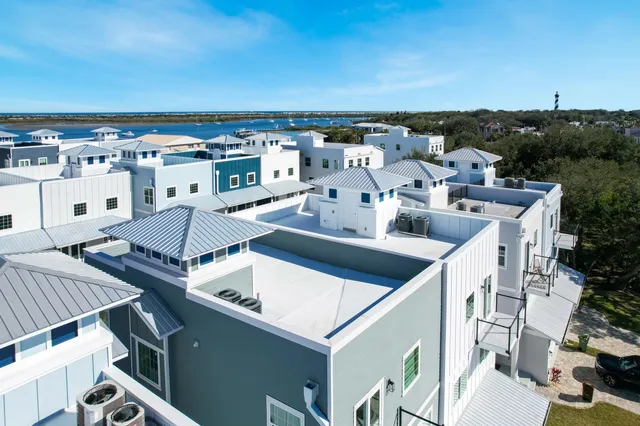an aerial view of a house with outdoor space