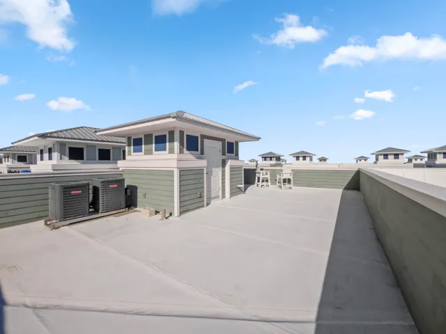 a view of residential houses with yard