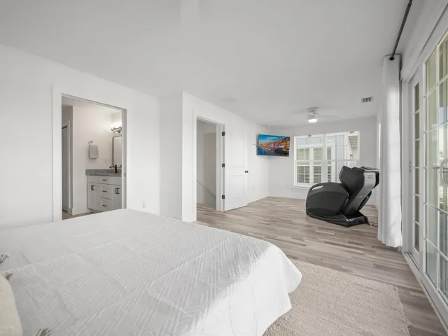 a bedroom with a bed and couch