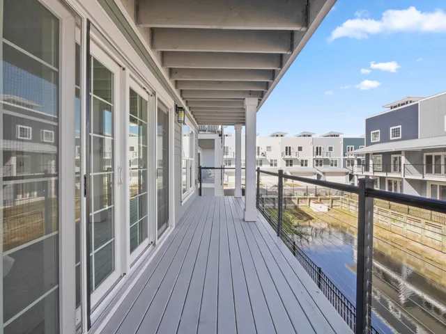 a view of a balcony with wooden floor