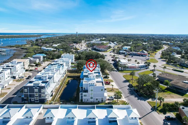 an aerial view of residential houses with outdoor space