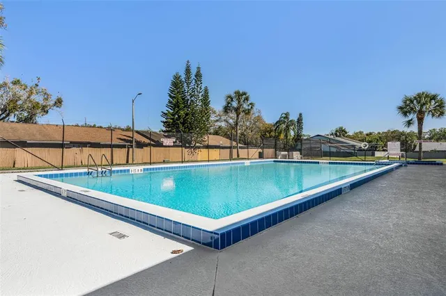 a view of a pool and outdoor space
