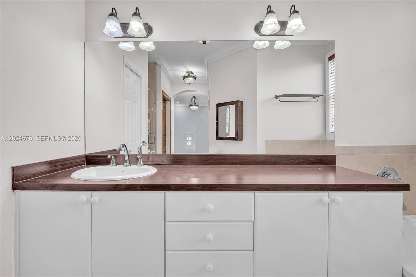 2155 Southwest 156th Court Miami, FL 33185 - Photo 49 of 57 a bathroom with a sink and a mirror