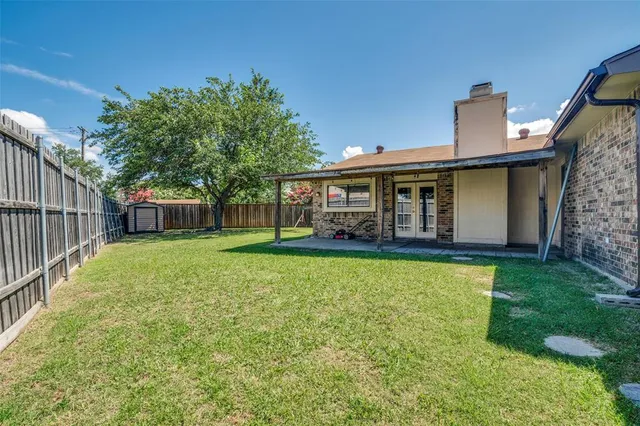 a backyard of a house with lots of green space