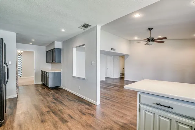 a view of a kitchen with a sink and a stove