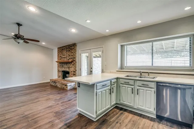 a kitchen with a sink stove and cabinets