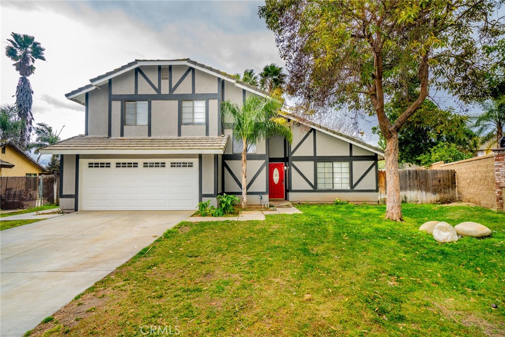 6130 Orchard Grove Way Riverside, CA 92505 - Photo 1 of 1 a view of an house with backyard and a tree